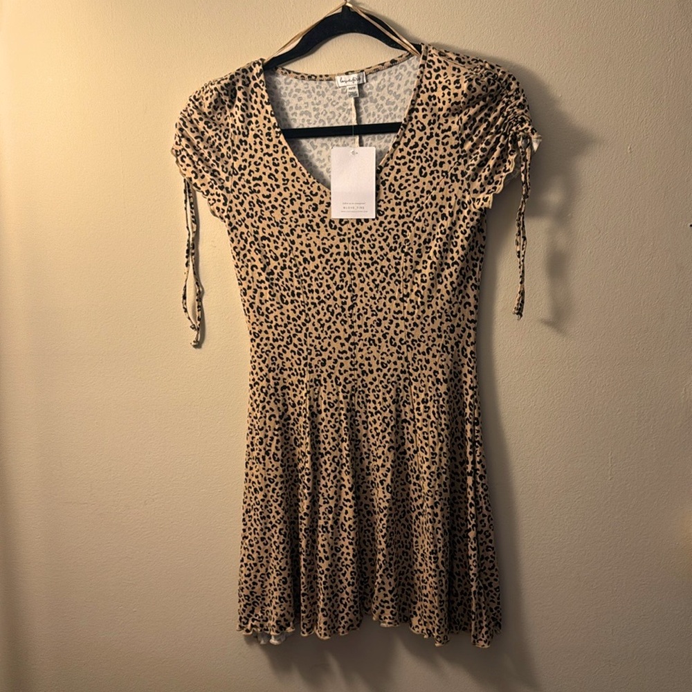 Thigh length, cheetah print dress.